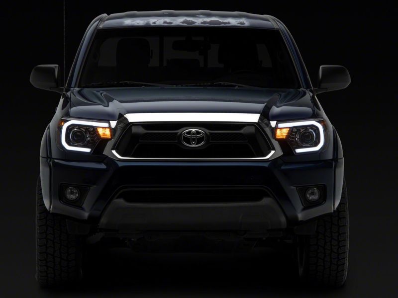 Raxiom 12-15 Toyota Tacoma Axial Projector Headlights w/ SEQL LED Bar- Black Housing (Clear Lens) thumbnail 4