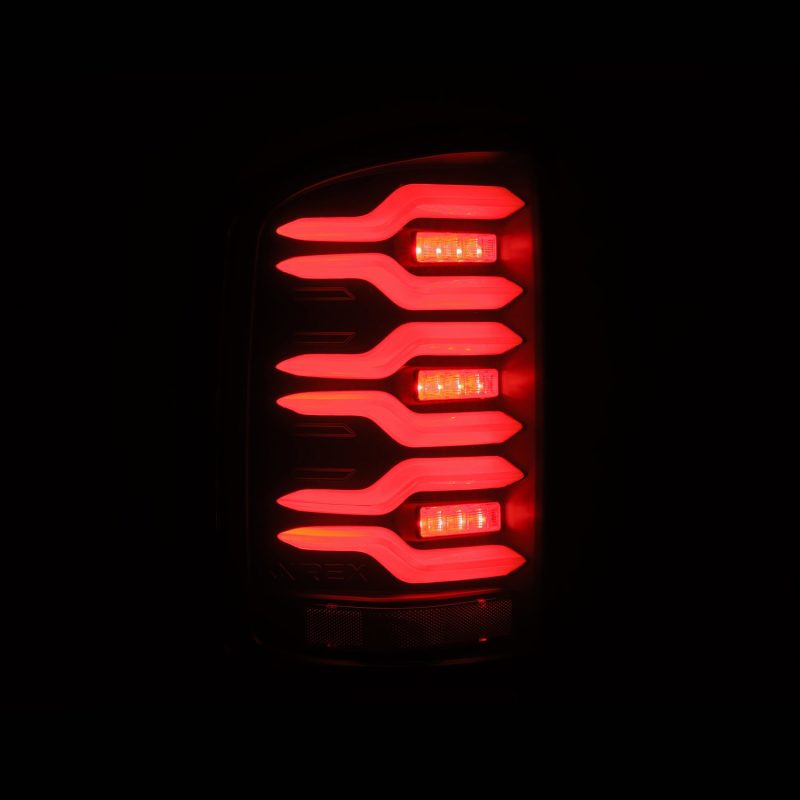 AlphaRex 14-18 GMC Sierra 1500/2500HD/3500HD LUXX-Series LED Tail Lights Blk w/Actv Light & Seq. Sig thumbnail 7