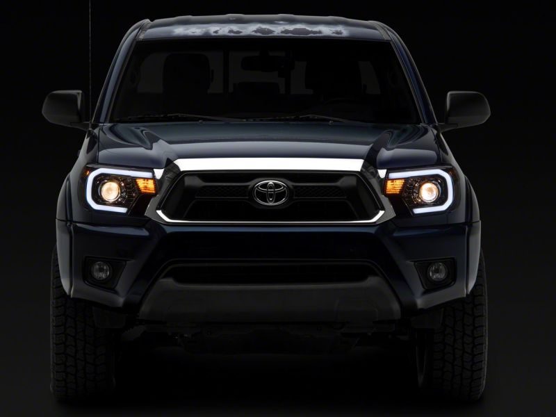 Raxiom 12-15 Toyota Tacoma Axial Projector Headlights w/ SEQL LED Bar- Black Housing (Clear Lens) thumbnail 8