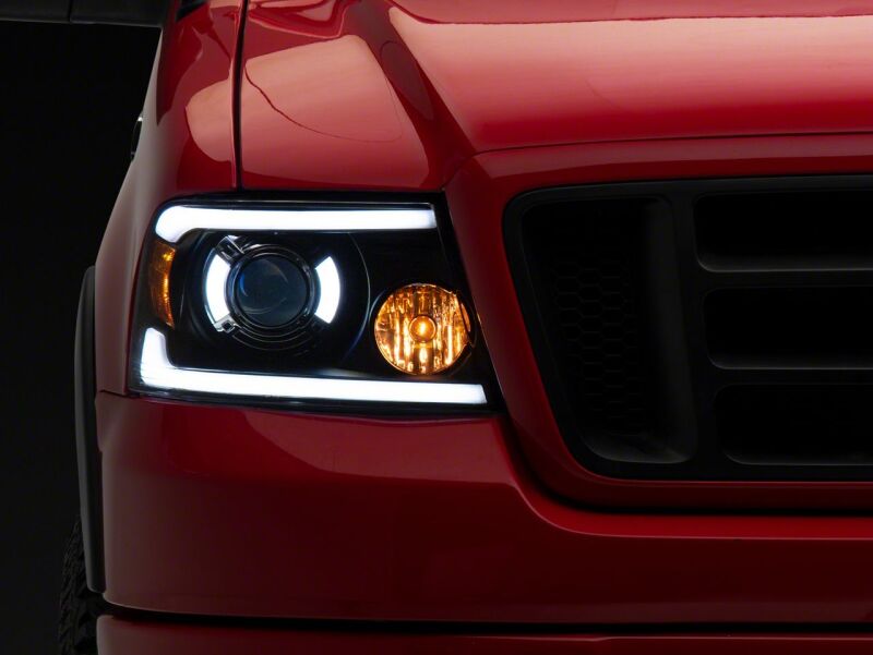 Raxiom 04-08 Ford F-150 Axial Series Projector Headlights with LED Bar- Black Housing- Clear Lens thumbnail 2